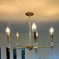 Two brass chandeliers