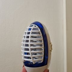 Plug in pest repeller and night light