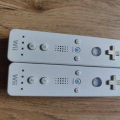 A pair of Original Nintendo Wii controllers.