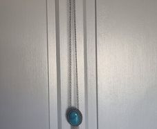 Long necklace, with turquoise centrepiece and fringe