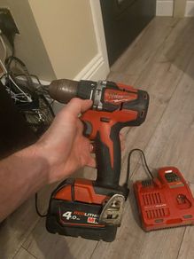 Nearly new Milwaukee M18 red 4.0 new charger pack and box