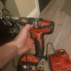 Nearly new Milwaukee M18 red 4.0 new charger pack and box