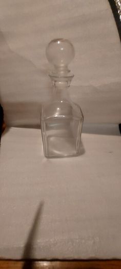 Art deco glass whiskey decanter with lid,,buyer collects or pays postage thank you, good patina condition,,sold as is, see pictures for condition,,