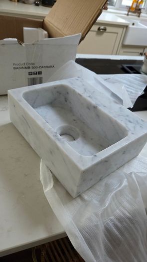 Cararra marble wall mounted sink