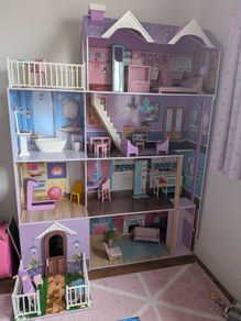 Large wooden dolls house with furniture