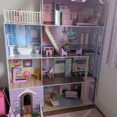 Large wooden dolls house with furniture