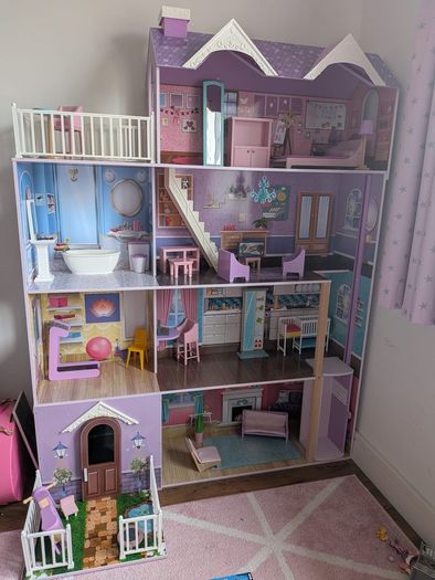 Large wooden dolls house with furniture