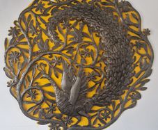 Large cut-metal peacock wall plaque