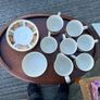 The set shown is a 1970s Arklow Pottery "Studio Kraft" tea/coffee set manufactured in County Wicklow, Ireland. It features a classic 1970s mid-century retro floral pattern in amber, orange, and brown tones with gold trim Image 6