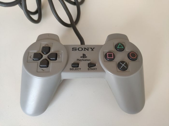 Playstation 1 console SCPH-7502 with games and cords
