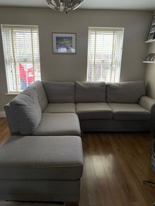 Corner sofa with footrest