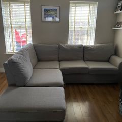 Corner sofa with footrest