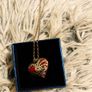 Heart-Shaped Pendant Necklace with Red Glass Heart and Wing Details Image 7