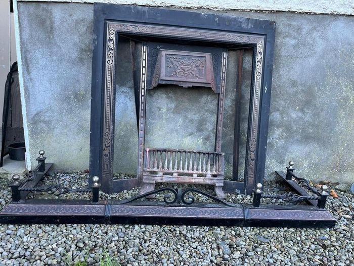 Wooden fireplace surround with carved details