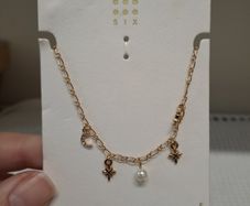 Golden necklace with charms