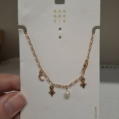 Golden necklace with charms