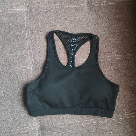 Black sports bra with white lettering, size 10