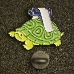 Tortoise with gun ! ,  pin back badge.