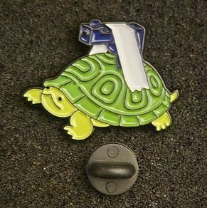 Tortoise with gun ! ,  pin back badge.