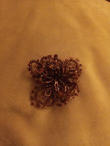 Beaded copper colour brooch