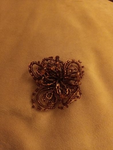 Beaded copper colour brooch