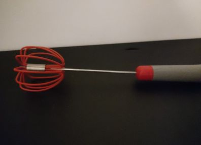 Spring loaded whisk