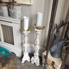 Two distressed candlesticks