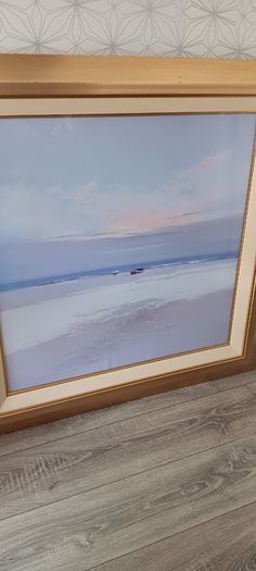 Two gold frame pictures with boats