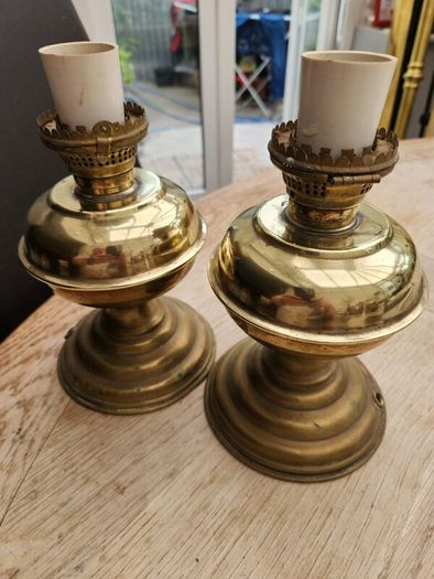a lovely pair of old brass lamps