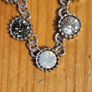 This matching silver-tone crystal necklace and bracelet set features alternating clear and black round stations with textured bezels.  SEE PHOTOS FOR SAME. Image 5
