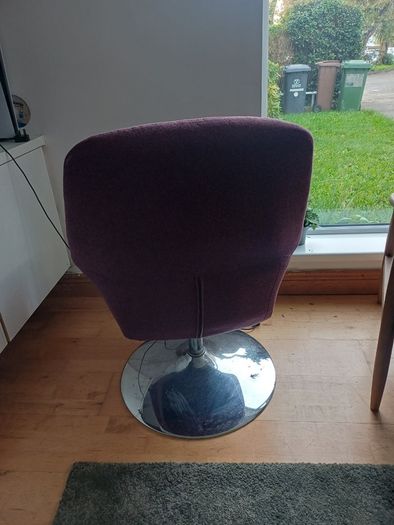 Purple swivel armchair with chrome base