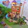 LEGO Friends XXL Shop Display Showcase New Never Used Lego Sets 41328 41335 And 41340 This is a cool lego display loads of moving parts when you turn the wheel it will turn the house around Also lights up plug in with AC plug Image 3