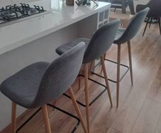 Kitchen counter stools x3, grey fabric. 1 stool wonky but still fine to sit on