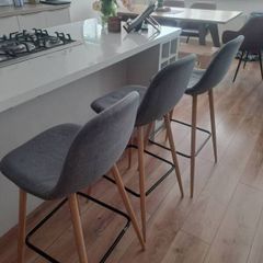 Kitchen counter stools x3, grey fabric. 1 stool wonky but still fine to sit on