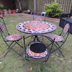 Ceramic table and four chairs.