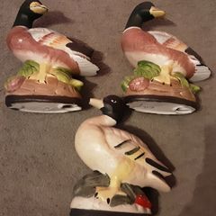 three duck figurines
