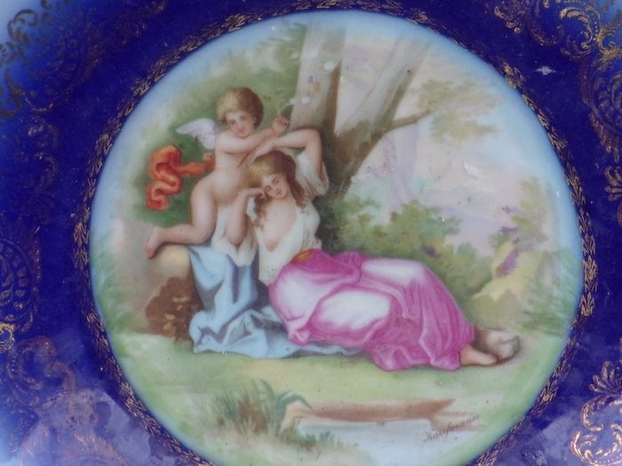 a large antique round plaque signed.kauffman