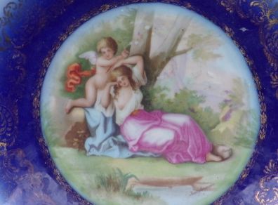 a large antique round plaque signed.kauffman