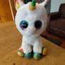 This is a Ty Beanie Boos Pixy the White Unicorn plush toy with large, glittery eyes Image 2