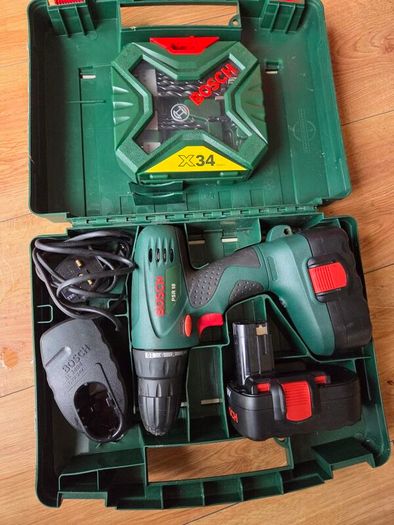 Bosch PSR 18 drill with 2 batteries, charger and brand new bits