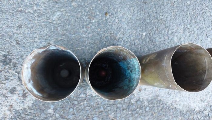 four empty brassartillery shell casings