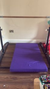 Gymnastics bar and mat