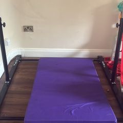 Gymnastics bar and mat