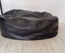 Two black leather-feel bean bags