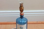 Drumshanbo Gunpowder Irish Gin bottle desk lamp with brass fittings and LED bulb   height 26cm