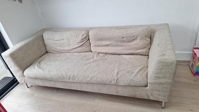 Three-seater beige fabric sofa