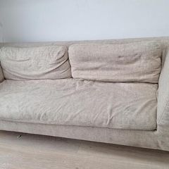 Three-seater beige fabric sofa