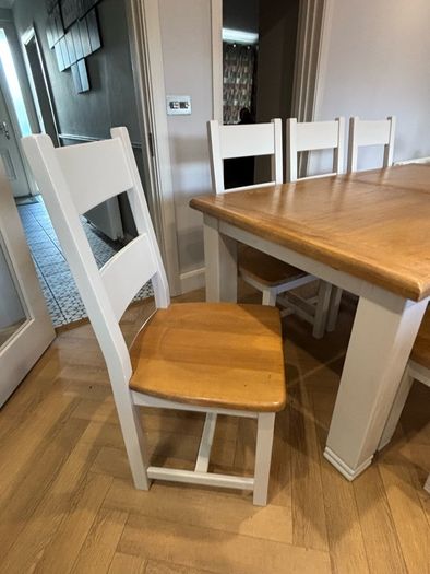 Large extendable 8 seater table with 5 chairs and a bench