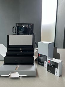 Leica Q typ 116, summilux lens  + hand grip w/finger loop.