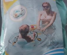 Pool Boat Floaty with little steering wheel.